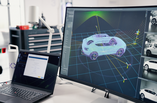 Two screens at a Kinetic workstation showing a 3D digital rendering of a Polestar being calibrated by the Kinetic system.